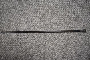 An antique walking cane, having Hallmarked silver handle with incised design.