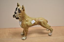 A metallic painted boxer dog ornament, 20cm long