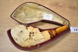 A vintage carved meerschaum pipe, in case, having oak leaf decoration, sold with a Victorian