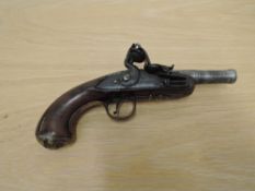 A small Flintlock Pistol with cannon barrel, decorated grip, lock plate & trigger guard, brass