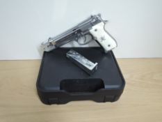 A M9 Military Gas Powered Automatic Pistol, calibre 9mm, numbered T29598M, in plastic case.