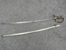 A Turkish Infantry Sword, brass stirrup guard and cross guard, wood & wire grip, engraved blade with