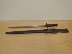 A British Bayonet pattern 1913, marked 1907 Wilkinson and other proof marks with leather scabbard,