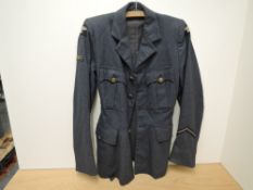 A WWII Ladies W.A.A.F Jacket, size no14, dated 1945 with buttons & cloth badges, one button missing