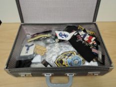 A collection of Military related Cloth Badges, Epaulettes etc, many items seen, in travel case