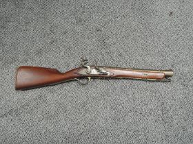 A Reproduction Flintlock Musket with brass barrel, Tower & GR Crown on lock plate, barrel length