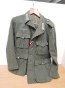 A German Military Jacket with cloth Lapel badges, Swastika & Eagle cloth badge, size medium, all