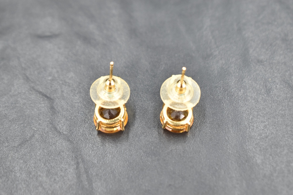 A pair of double stone citrine stud earrings spaced by a row of diamond chips, all in a yellow metal - Image 3 of 3