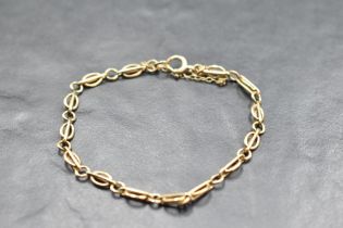 A yellow metal fancy link bracelet, no marks but probably 9ct gold, approx 5.1g