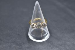 A diamond trilogy ring, total approx 1.75ct, all three old cut diamonds in collared mounts on a