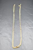 A yellow metal rope link muff chain having inset seed pearls, approx 56' & 17.9g