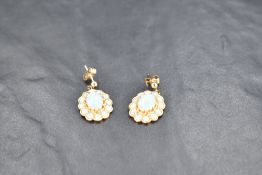 A pair of 9ct gold stud earrings having large opal cluster drops, approx 5g gross