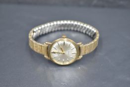 A 9ct gold wrist watch by Rotary having baton numeral dial to champagne face in a gold case on a