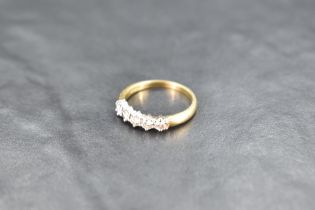 A five stone diamond half eternity ring, approx 0.45ct total on an 18ct gold loop, size O & approx