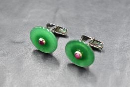 A pair of silver cufflinks by Belfiore having Jade style circular panels with red cabochon centres