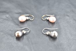 A pair of pink pearl and diamond drop loop earrings having 18ct gold fittings and a similar pair