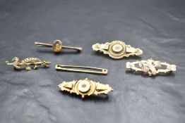 A group of six 9ct gold and yellow metal bar brooches, one marked 10ct, and 2 marked 9ct the