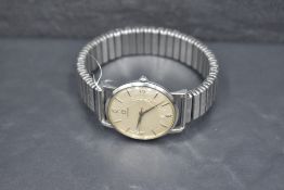 A gent's vintage automatic wrist watch by Omega having Arabic and baton numeral dial to cream face
