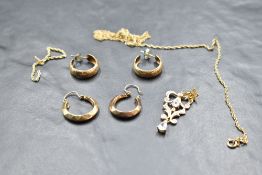 A small selection of 9ct gold and yellow metal jewellery including broken chain, hoop and odd