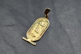 An Egyptian gold pendant depicting hieroglyphics for VMR, approx 4g