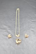 An 18ct gold three piece jewellery suite by Boodle & Dunthorne in the 1990's Hug design,