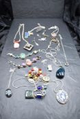 A selection of silver and white metal necklaces, bracelets and pendants, many stamped silver/925
