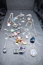 A selection of silver and white metal necklaces, bracelets and pendants, many stamped silver/925