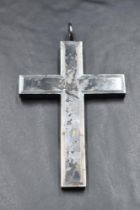 An oversized white metal cross pendant of brutalist hollow form, approx 90mm long & 20g