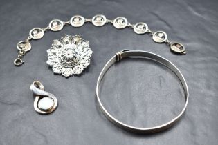 A small selection of silver and white metal jewellery including Ortak silver bracelet having nine