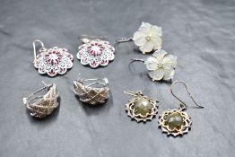 Four pairs of silver earrings for pierced ears, including cubic zirconia set hoops, mother of