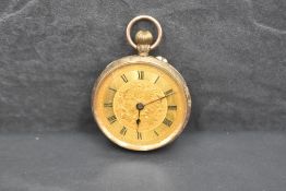 A small 9ct rose gold key wound pocket watch having Roman numeral dial to decorative gold face in