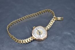A lady's vintage 9ct rose gold wrist watch having Arabic numeral dial to decorative face in rose