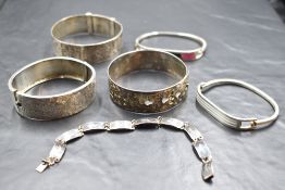 A selection of silver and white metal bangles and bracelets including Mexican enamelled, Siam