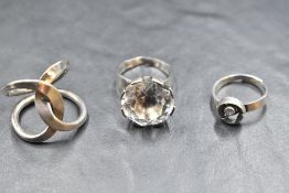 Three Scandinavian silver rings including rock crystal by Karl Laine, Norwegian double loop ring,
