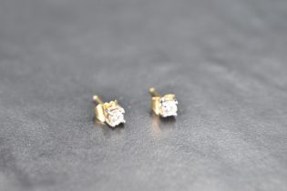 A pair of diamond solitaire stud earrings for pierced ears, each stone approx 0.125ct in claw set