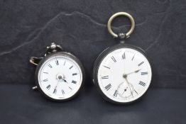 Two silver key wound pocket watches, both having Roman numeral dials