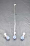 An 18ct white gold pendant and matching earrings having moonstone, diamond and angelite style