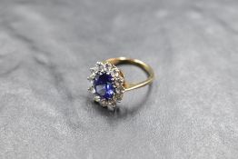 A blue and white stone paste cluster ring on a 9ct gold loop, size O & approx 3.2g
