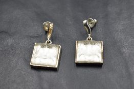 A pair of silver earrings by Lalique having bar drops to Arethuse crystal panels in silver mounts