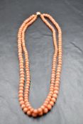 A double string of graduated coral beads with yellow metal box clasp,approx 18' & 41.4g