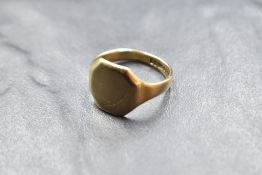 A 9ct gold signet ring having a worn decorative engraved panel, size N & approx 4.4g