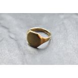 A 9ct gold signet ring having a worn decorative engraved panel, size N & approx 4.4g