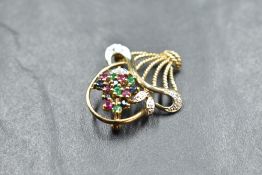 A 9ct gold brooch modelled as a basket of flowers with multi precious stone decoration, approx 3.2g