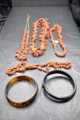 Four vintage branch coral necklaces, an Indian style bangle and a horn serpent bangle