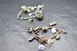 A charm bracelet having twelve white metal and silver charms and shields including steam train, fire