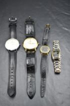 Four modern wrist watches including ladies Tissot & Gucci, and gent's DW & Rotary