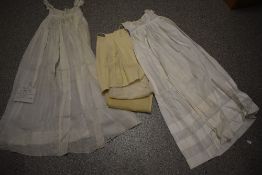 An infants lawn cotton gown, circa 1830s, having the tiniest hand sewn pin tucks to hem and skirt,
