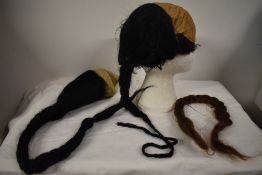 A selection of vintage and antique hair pieces, including plaits.