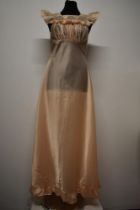 A vintage pale pink nightdress, having Brettles label (Belper) with gathered bodice and tie belt