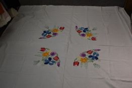 A 1920s/30s linen bed coverlet, having stunning hand worked floral decoration to centre, using a